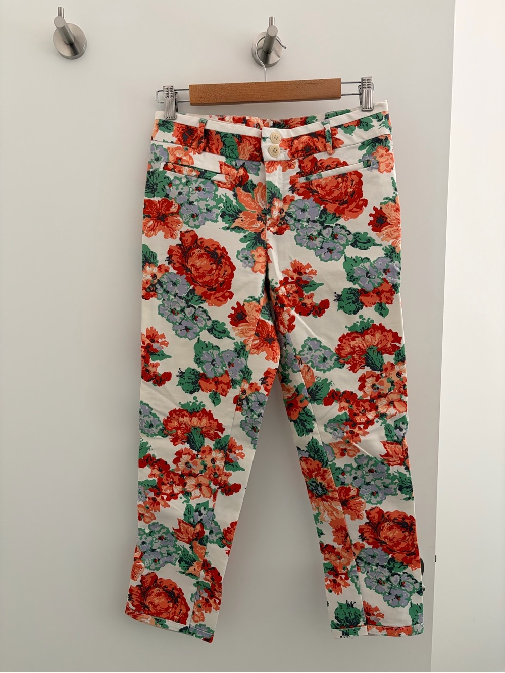 Anthropologie Cartonnier crop trousers. White with red, pink, and blue flowers.